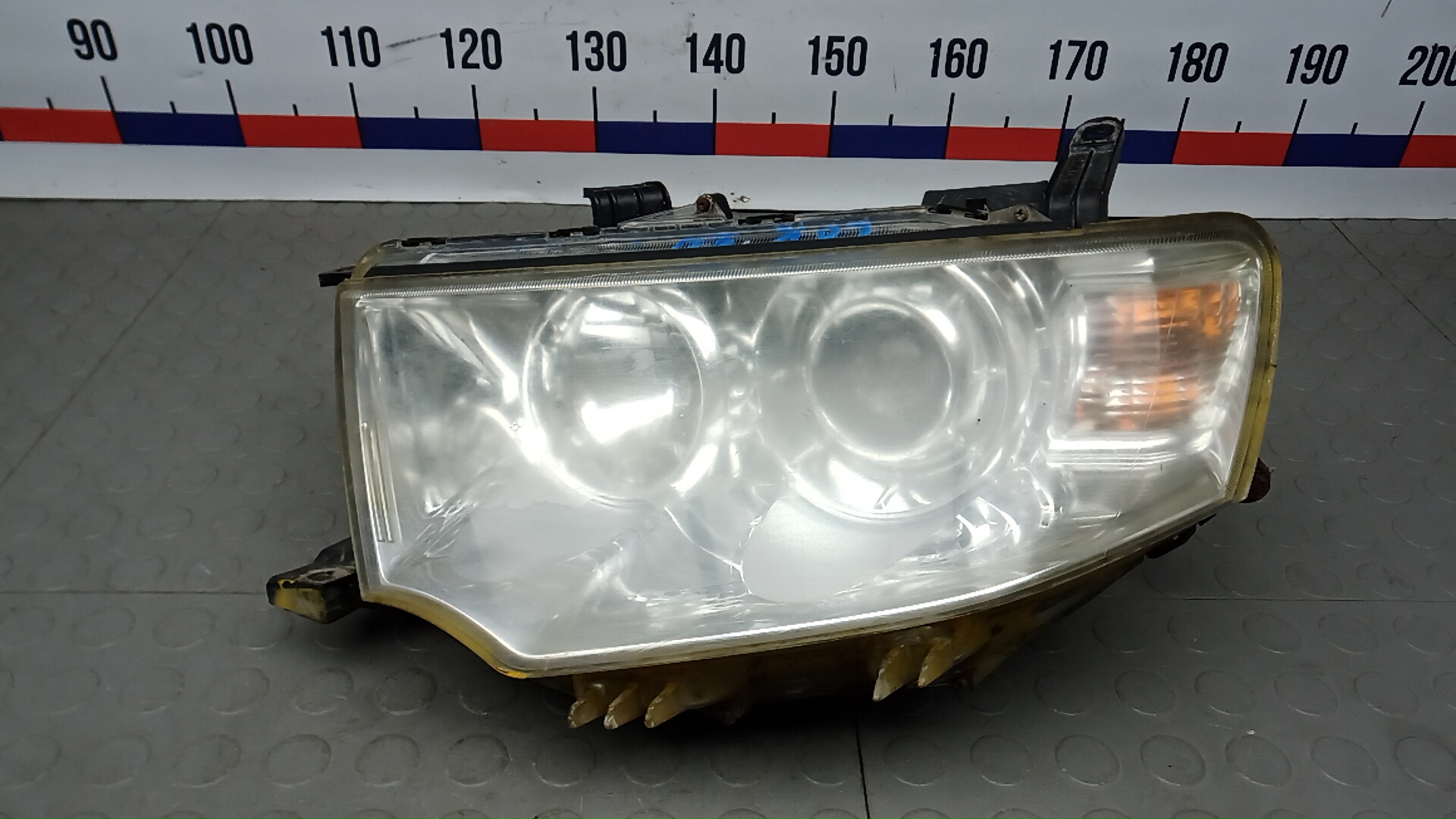 Фара левая Mitsubishi L200 K4T
