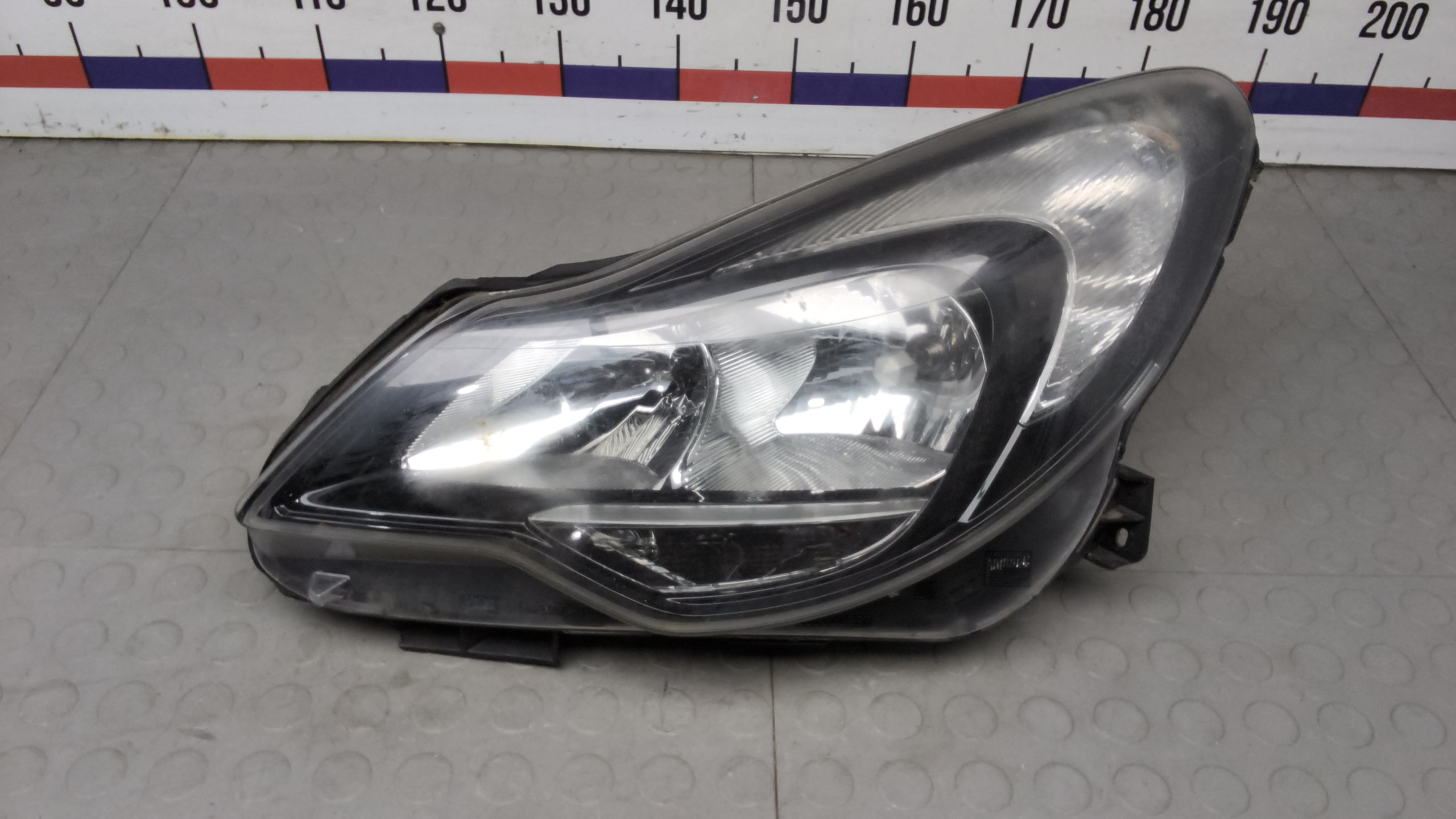 Фара левая Opel Corsa D