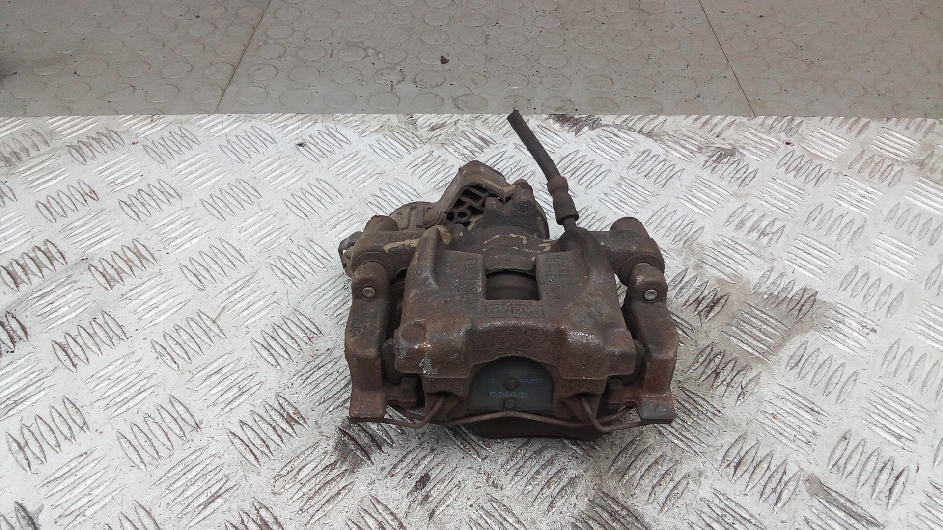 Суппорт тормозной задний левый Ford Focus 4