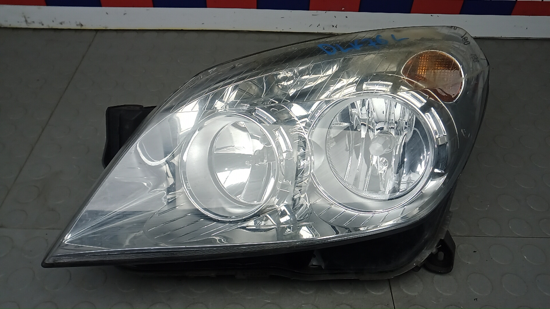 Фара левая Opel Astra H